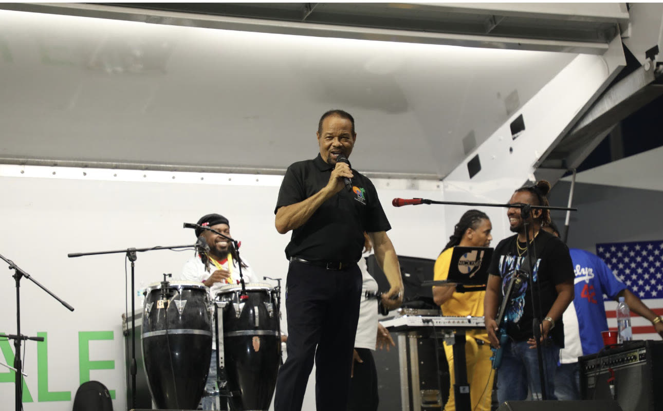 A vocalist performs with a live band at the Mayor's Community Concert