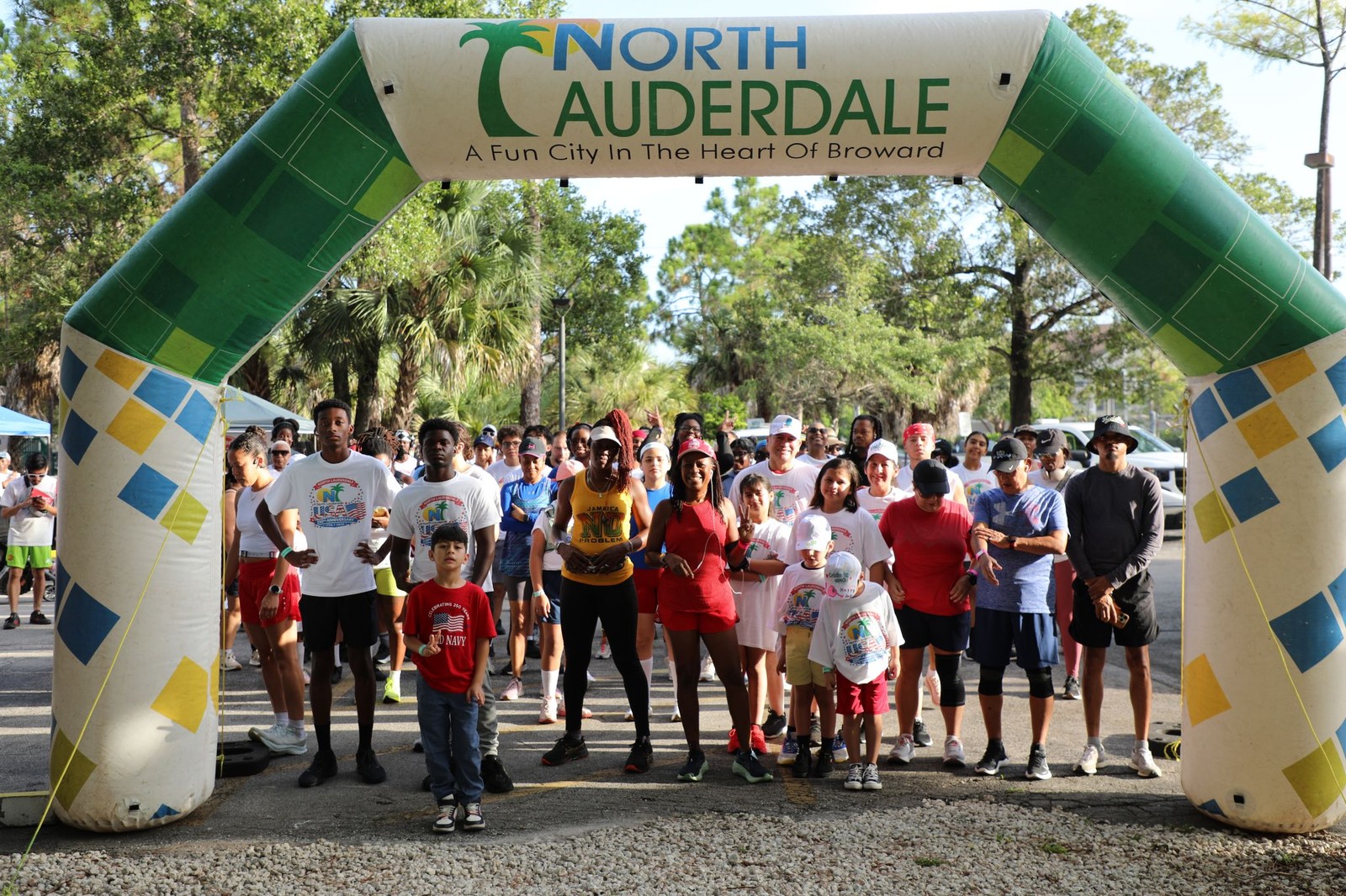 Residents gather under the North Lauderdale arch at the 5K Walk